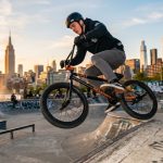 Mechanic installing alloy BMX pedals at a local New York City bike shop.