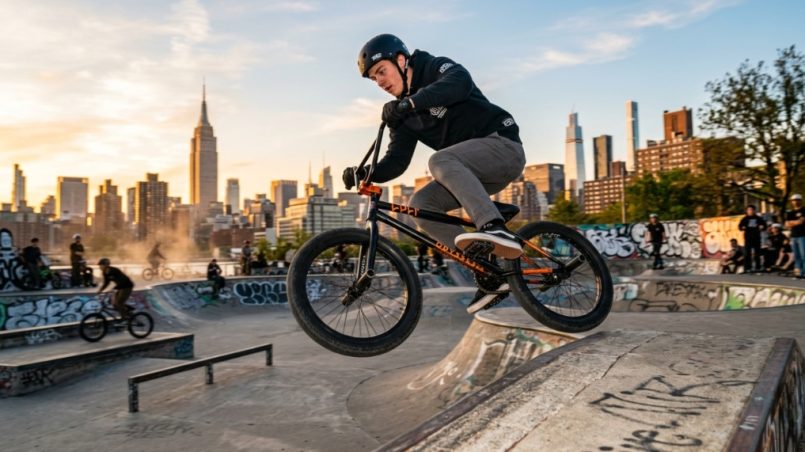 Mechanic installing alloy BMX pedals at a local New York City bike shop.